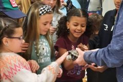 Ms-T-with-children-standing-scaled